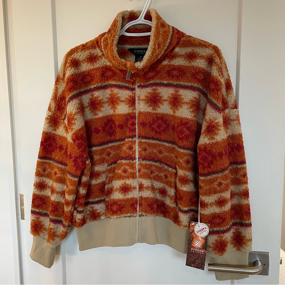 Tan and orange Kyodan zip up sherpa sweater